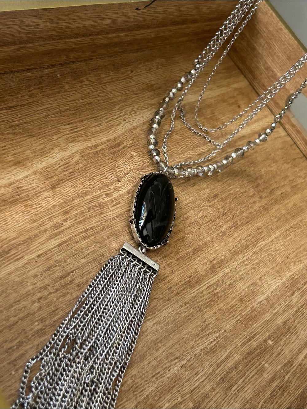 Layered Silver Necklace with Black Stone Pendant and Tassel